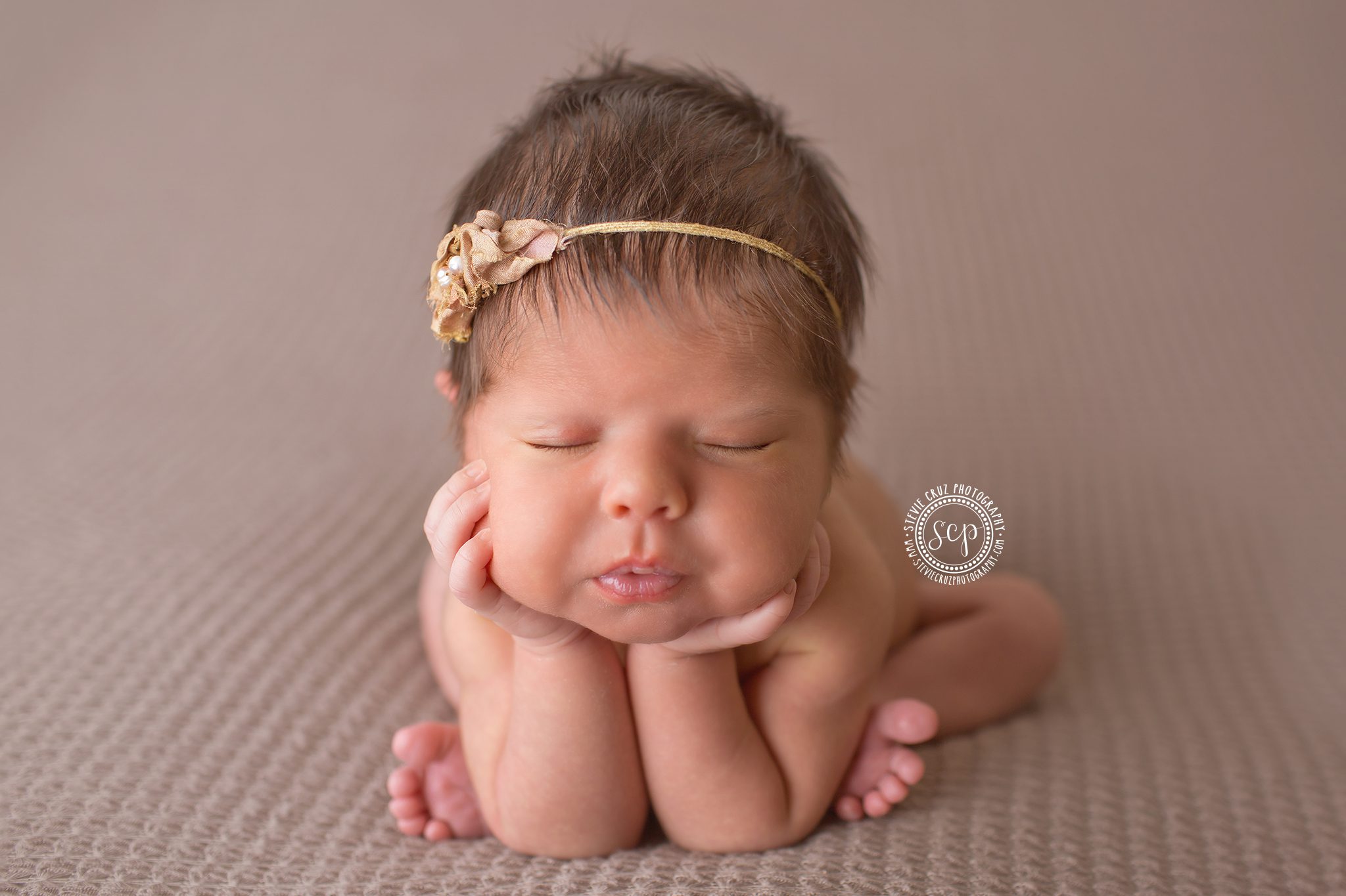 Newborn Head on Hands Pose