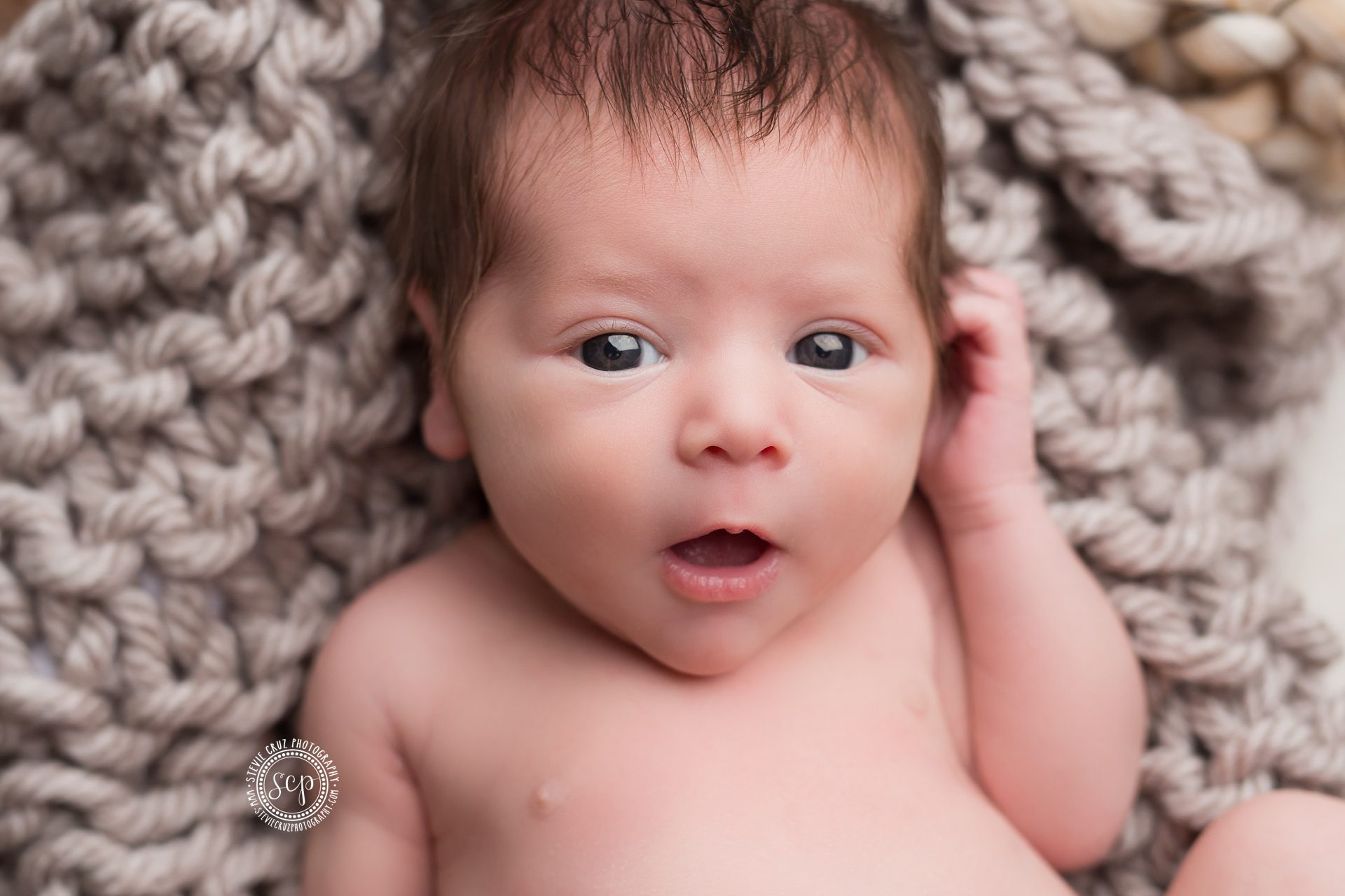 I can not get enough of this baby boy's eyes and stare. He was great for his newborn photo session in OC, California 