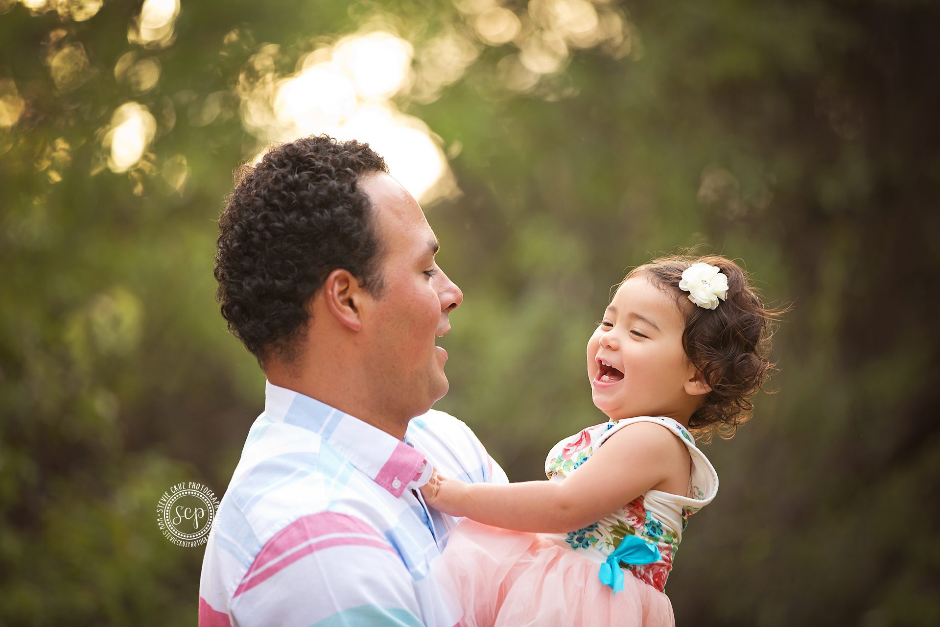 happy big sister with daddy for her mommies Orange county maternity portraits. 
