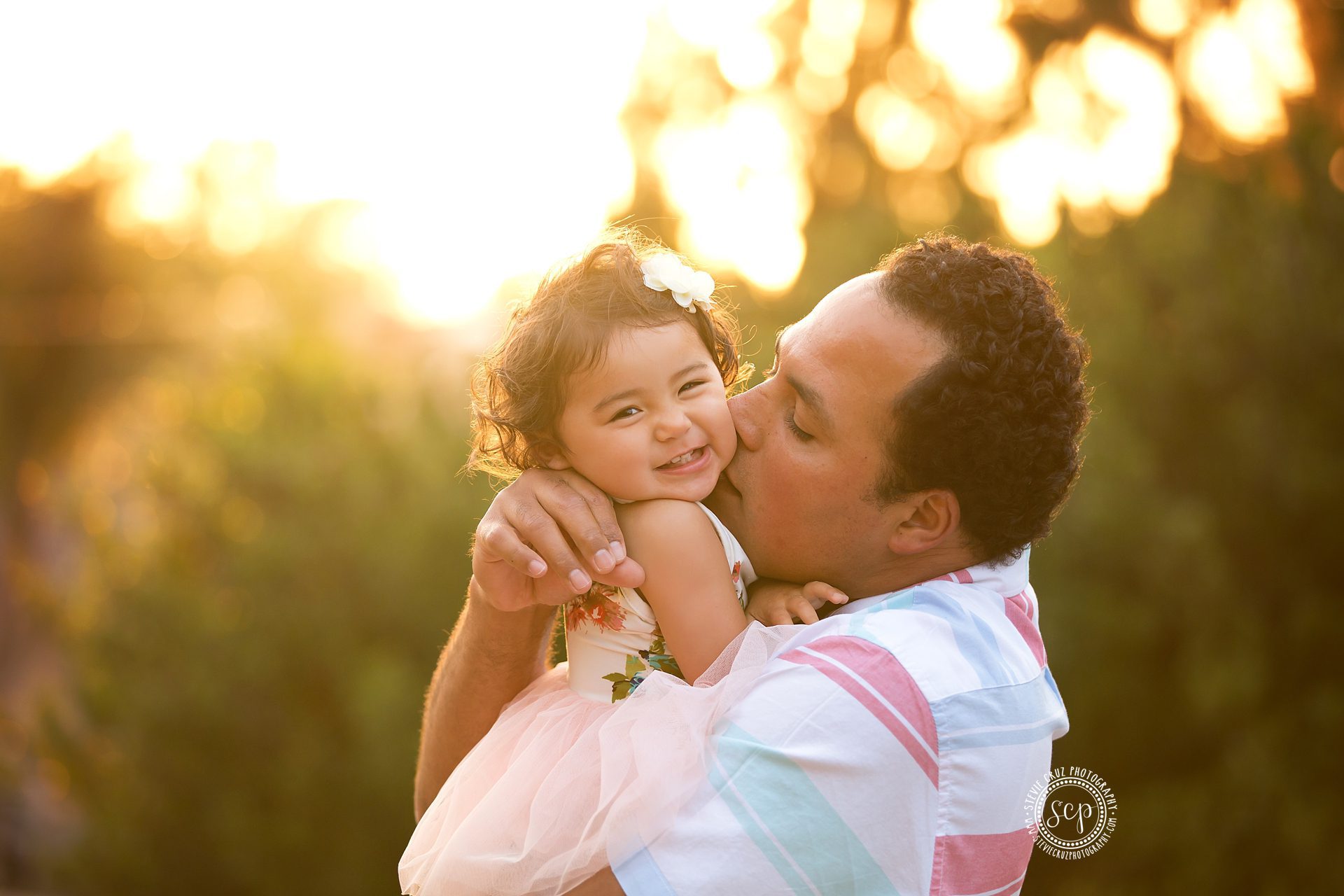 daddy snuggles and kisses are the best. Best Orange County kids photographer captures this cutie