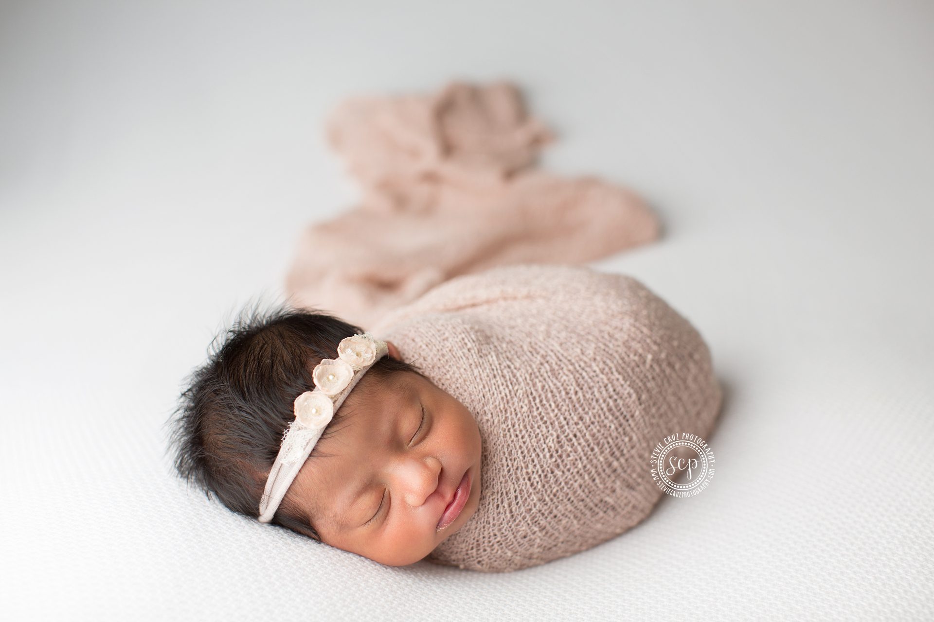 newborn baby girl pose ideas. Best Orange County Newborn photographer captures cute baby
