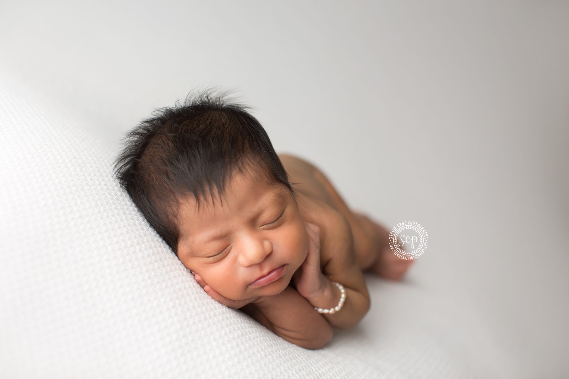  Best Orange County Newborn photographer captures precious baby girl. Love her pearl bracelet so cute