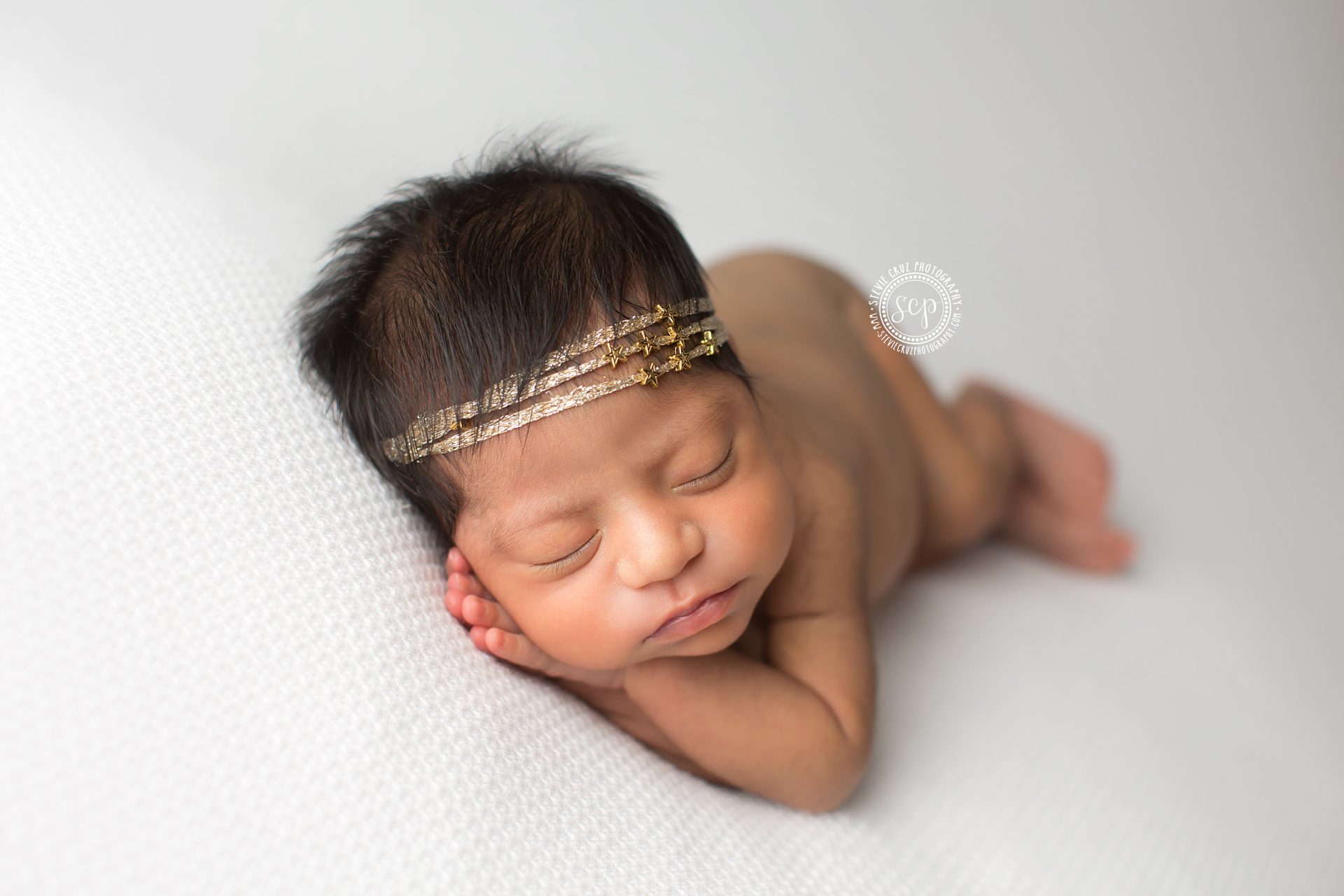 Love this gold headband with stars that this cute newborn baby wore for her newborn pictures 